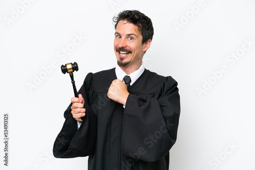 Young judge caucasian man isolated on white background celebrating a victory