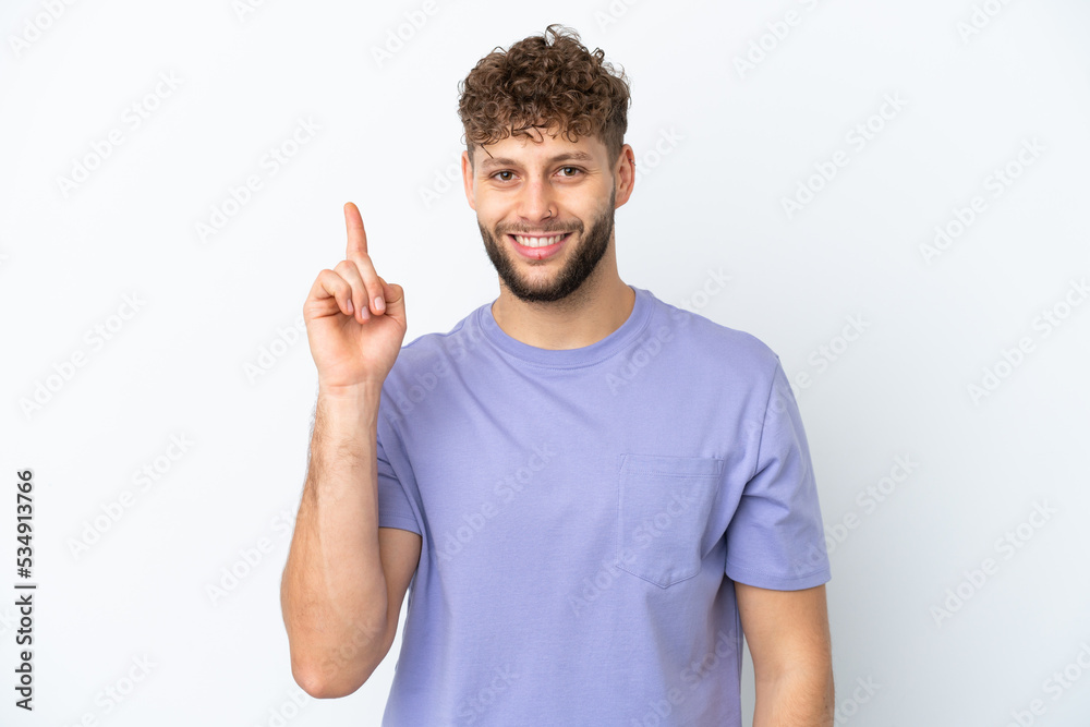 Young handsome caucasian man isolated on white background showing and lifting a finger in sign of the best Young handsome caucasian man isolated on white background showing and lifting a finger in sign of the best