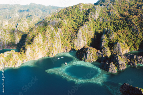 View from above, stunning aerial view of the Twin Lagoons surrounded by rocky cliffs. The Twin Lagoons are one of the must-see destinations in Coron Island. Palawan, Philippines.