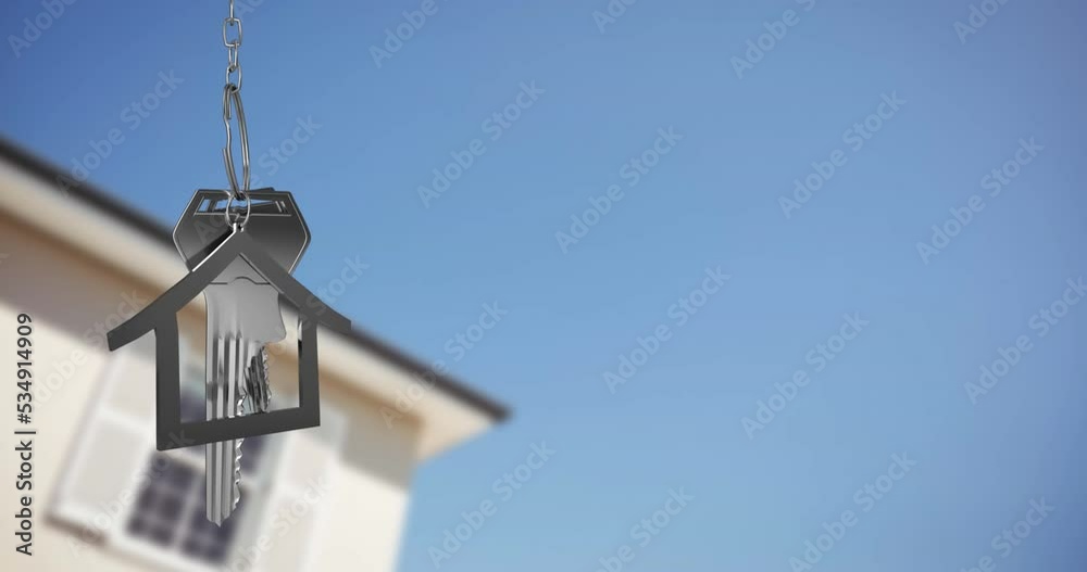 Animation of silver house key fob with key over out of focus house and copy space on sky Animation of silver house key fob with key over out of focus house and copy space on sky