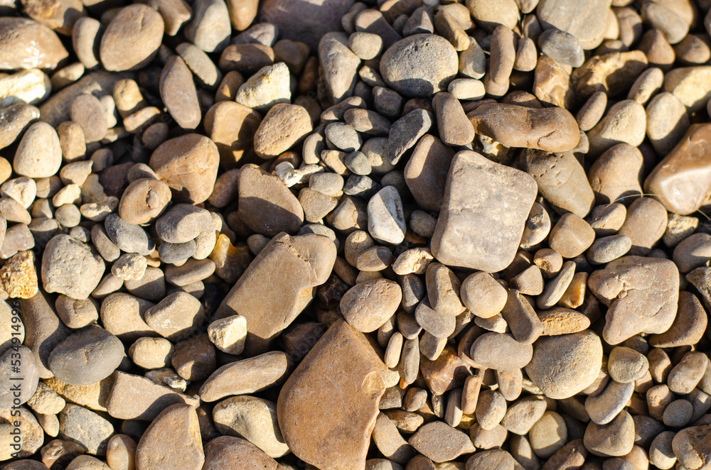 Sea pebbles lie on the shore. Rock. Decorative stones. Sea pebbles lie on the shore. Rock. Decorative stones.