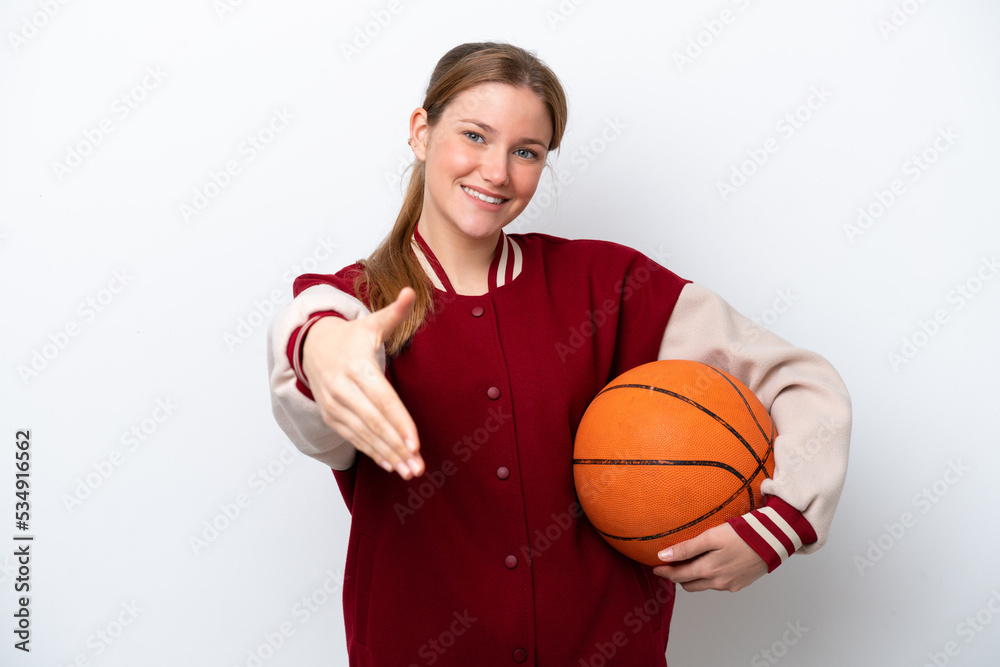 Young basketball player woman isolated on white background shaking hands for closing a good deal