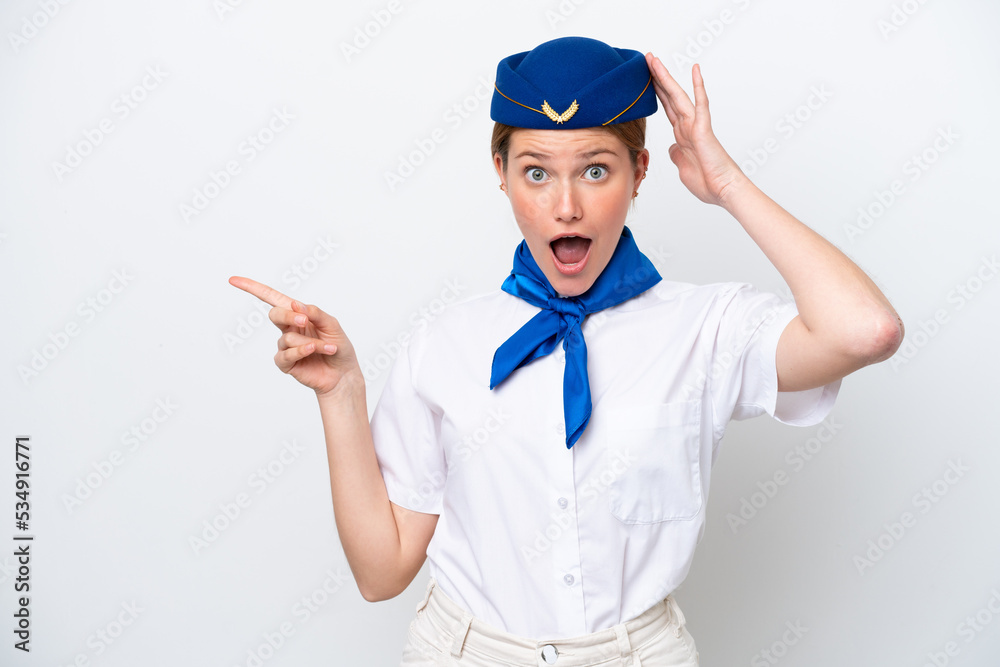 Airplane stewardess woman isolated on white background surprised and pointing finger to the side Airplane stewardess woman isolated on white background surprised and pointing finger to the side