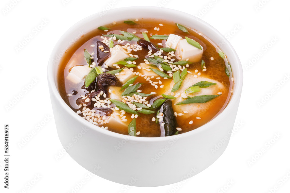 Thai soup with tofu and tree fungus, sprinkled with sesame seeds, on a white background, isolate Thai soup with tofu and tree fungus, sprinkled with sesame seeds, on a white background, isolate