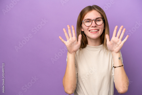 Young English woman isolated on purple background counting ten with fingers