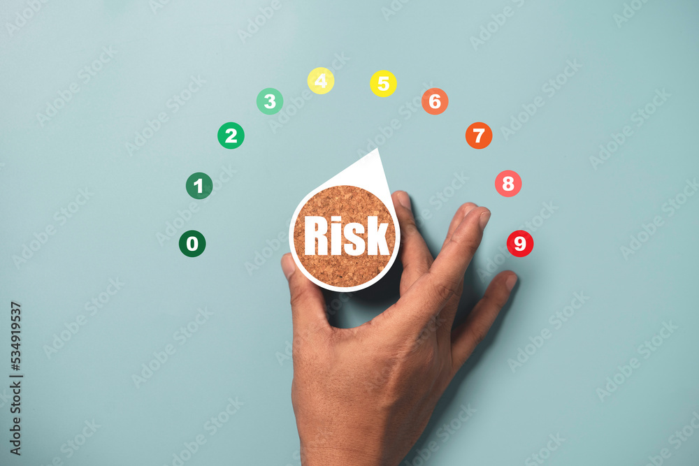 Medium Risk Hand Photo Hand turning risk level indicator rating print screen wooden cube ...