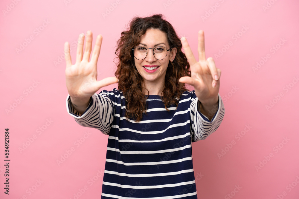 Young caucasian woman isolated on pink background counting eight with fingers Young caucasian woman isolated on pink background counting eight with fingers