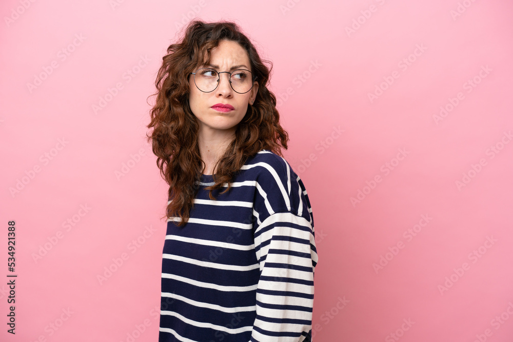 Young caucasian woman isolated on pink background . Portrait Young caucasian woman isolated on pink background . Portrait