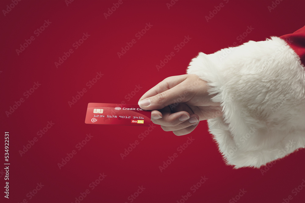 Santa Claus paying with a credit card Santa Claus paying with a credit card