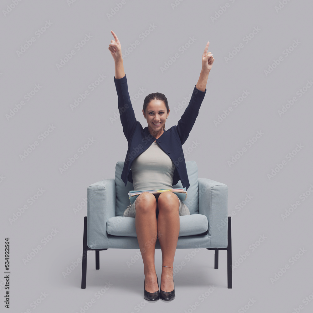 Cheerful businesswoman in the waiting room Cheerful businesswoman in the waiting room