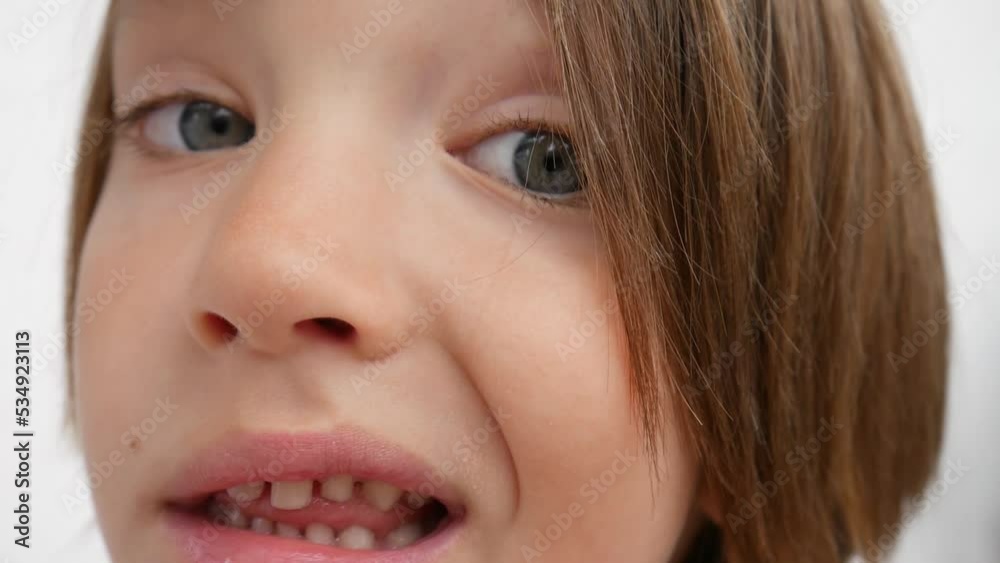 Close-up of the face of a little funny boy staring at something Close-up of the face of a little funny boy staring at something