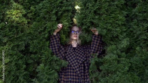 Stylish blond hair woman just dissapear in trees photo