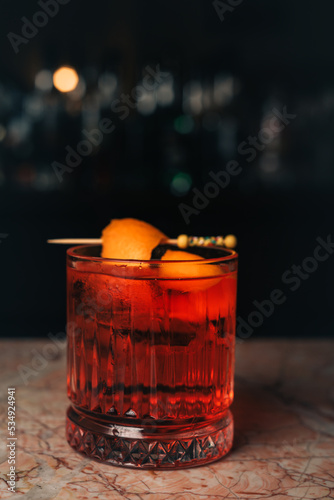 Classic cocktail Negroni with gin, campari and martini rosso.