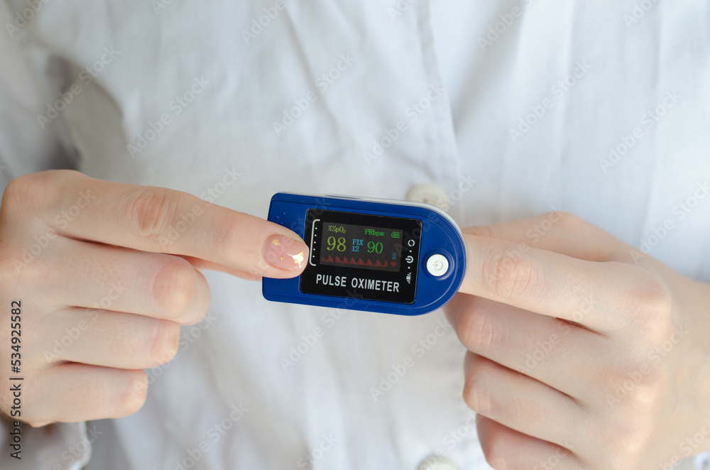 Pulse oximeter. Medical device on the finger. Patient diagnosis. Covid-19. Saturation measurement. Pulsometer. Glucometer. Blood sugar level. The level of oxygen in the blood. Tonometer. Pulse oximeter. Medical device on the finger. Patient diagnosis. Covid-19. Saturation measurement. Pulsometer. Glucometer. Blood sugar level. The level of oxygen in the blood. Tonometer.