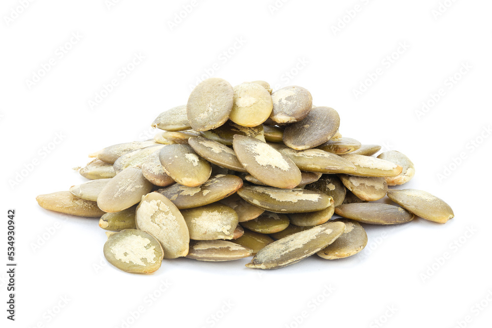 Pumpkin seeds on white background. Green pepita seeds. Pumpkin seeds on white background. Green pepita seeds.
