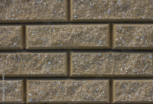 Brick wall texture seamless. Yellow brown stone pattern background