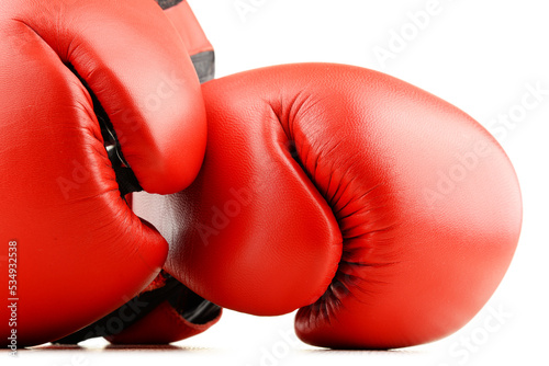 Pair of red leather boxing gloves isolated on white © monticellllo