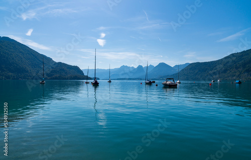 Wolfgangsee lake and mountains, St Gilgen, Austra. Tranguil landscape, blue sky and calm water. Sunny summer day.