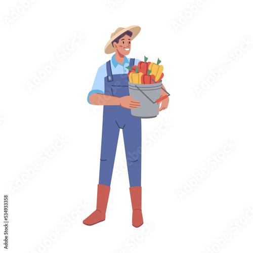 Farming man personage wearing uniform holding bucket of harvested bell peppers. Growing organic vegetables. Flat cartoon character, vector in flat style © Sensvector