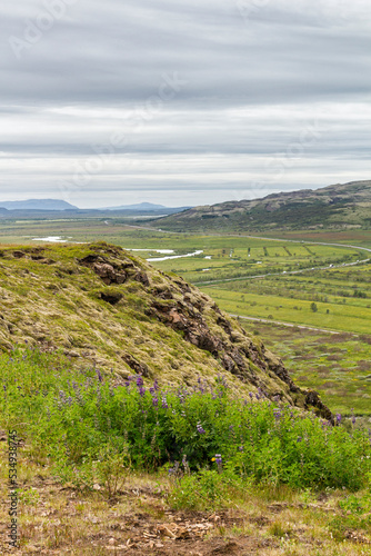 a panoramic view over the grassland and mountains at the region of  Bl  sk  gabygg    iceland