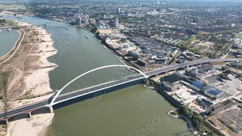 De Oversteek also called City Bridge is a bridge for car traffic over the Waal in Nijmegen. Span hanging bridge. Aerial drone view urban city skyline photo