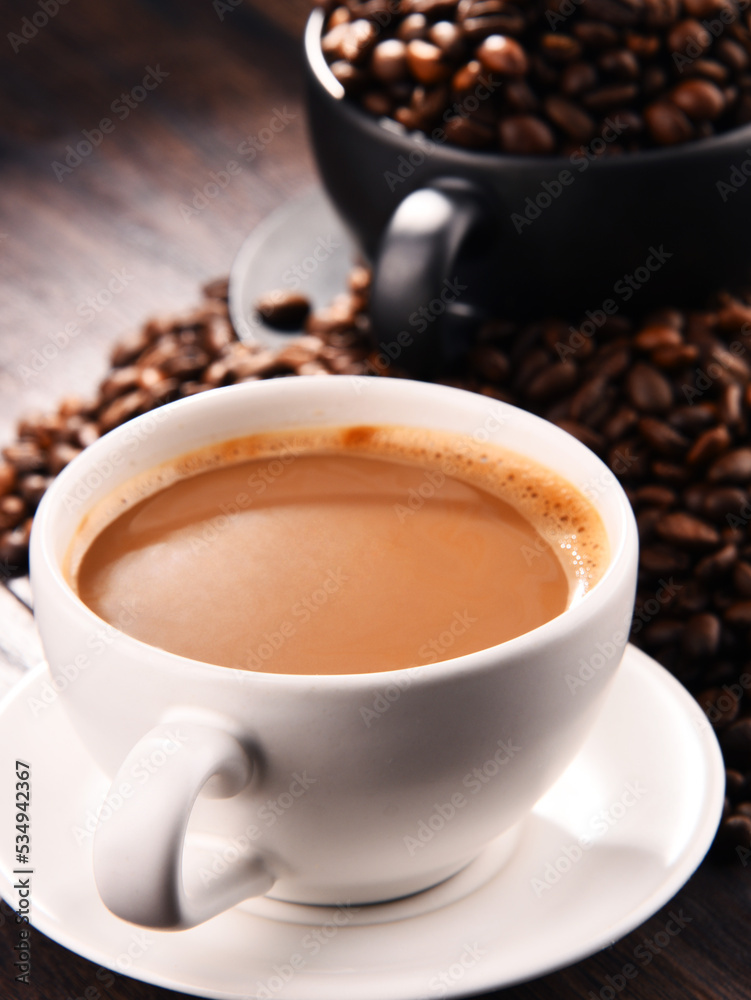 Composition with two cups of coffee and beans Composition with two cups of coffee and beans
