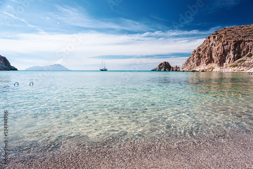 Plathiena beach with crystalline water on Milos island in Greece photo