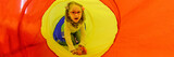 Girl living with cerebral palsy playing in sensory room, snoezelen, during therapy session. People with cerebral palsy can have problems swallowing and commonly have eye muscle imbalance. 