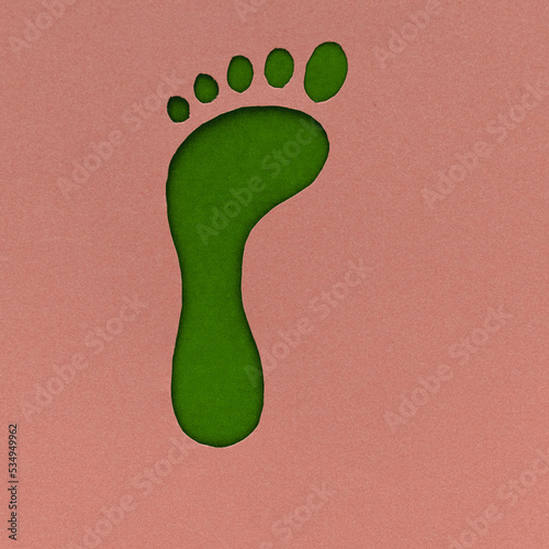 Go green and foot care concept, paper cut footprint silhouette on flat lay, overhead view.