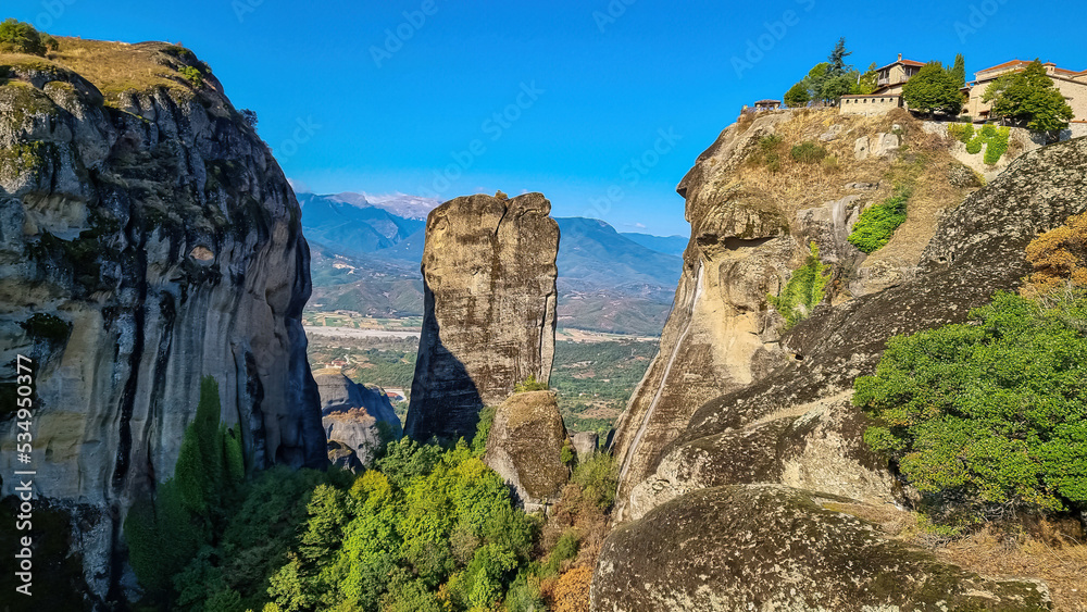 Panoramic view of Holy Monastery of Great Meteoron and Holy Monastery of Varlaam near Kalambaka, Meteora, Thessaly, Greece, Europe. Dramatic landscape. Orthodox landmark build on rock formations