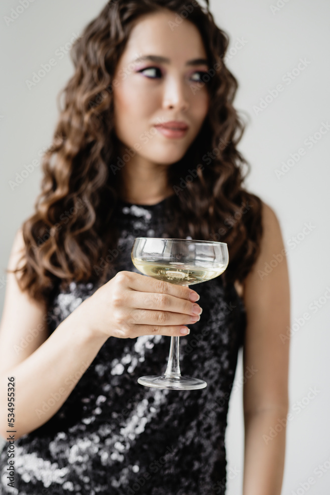 Beautiful asian woman holding glass with sparkling wine. Beautiful asian woman holding glass with sparkling wine.