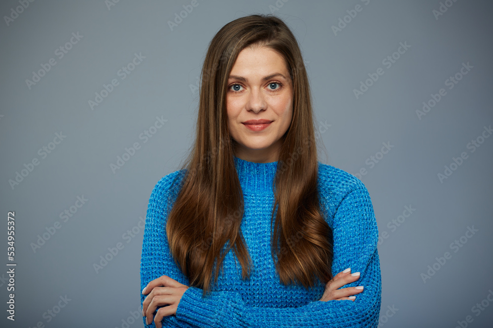Smiling woman in casual blue warm sweater. Isolated female portrait. Smiling woman in casual blue warm sweater. Isolated female portrait.