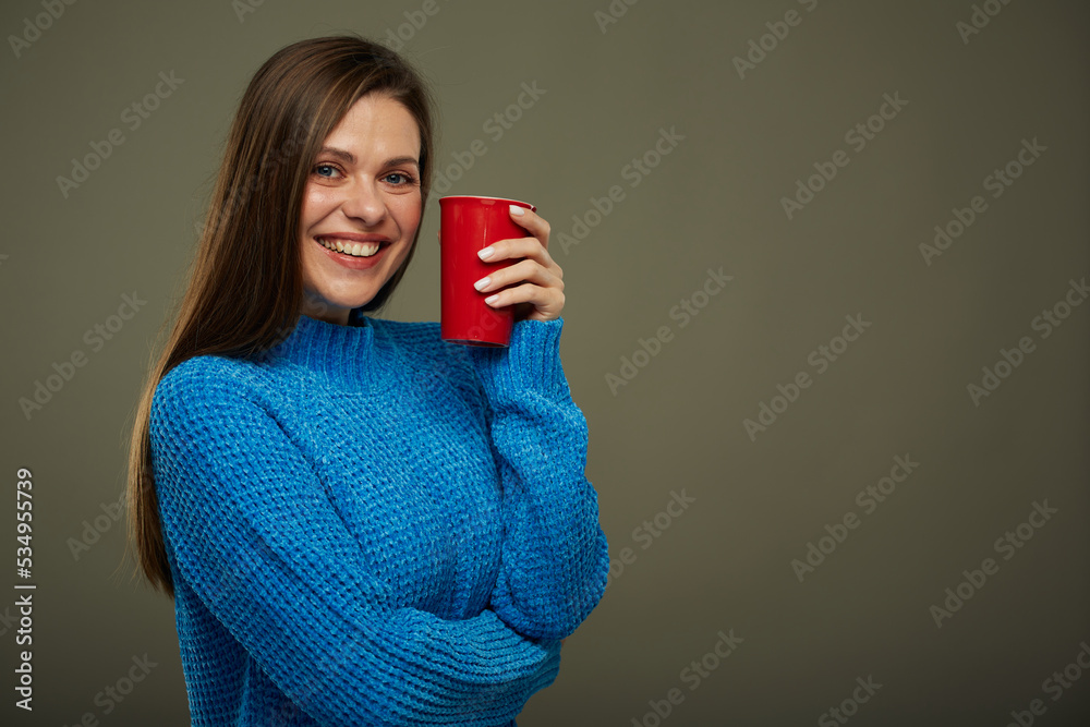 Woman holding red mug for hot drink. Isolated portrait. Woman holding red mug for hot drink. Isolated portrait.