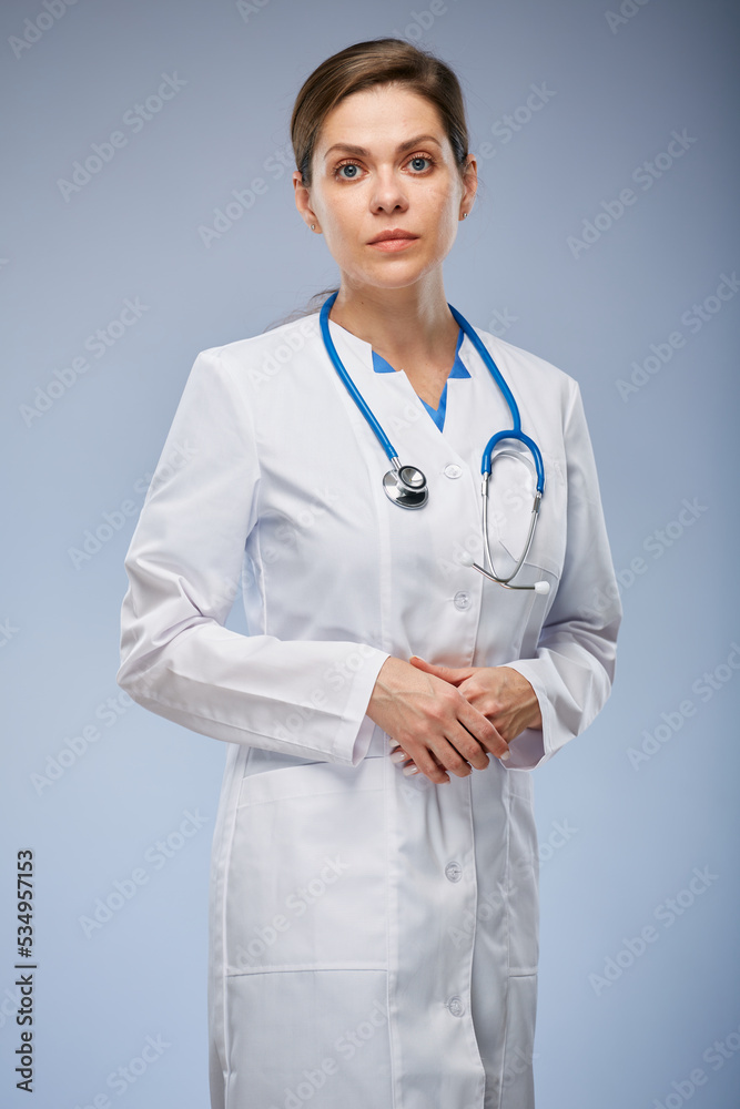 Serious doctor woman in white coat. Isolated portrait. Serious doctor woman in white coat. Isolated portrait.