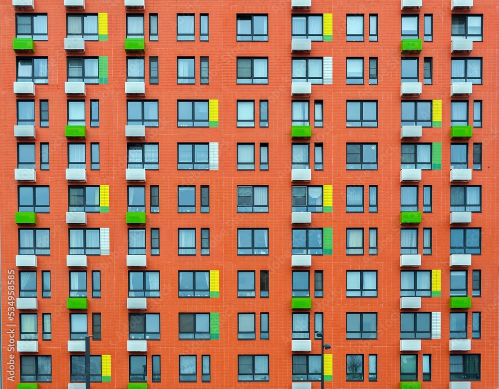 The red wall of a multi-storey building
