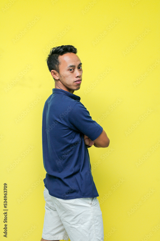 a man wearing a blue shirt and white pants a man wearing a blue shirt and white pants