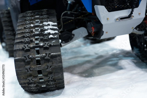 Close up of a tracked snowmobile