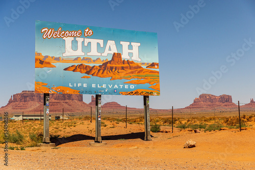 UTAH, UNITED STATES - SEPTEMBER 4, 2022: Utah sign across the road to Monument Valley a region of the Colorado Plateau characterized by a cluster of vast sandstone buttes.