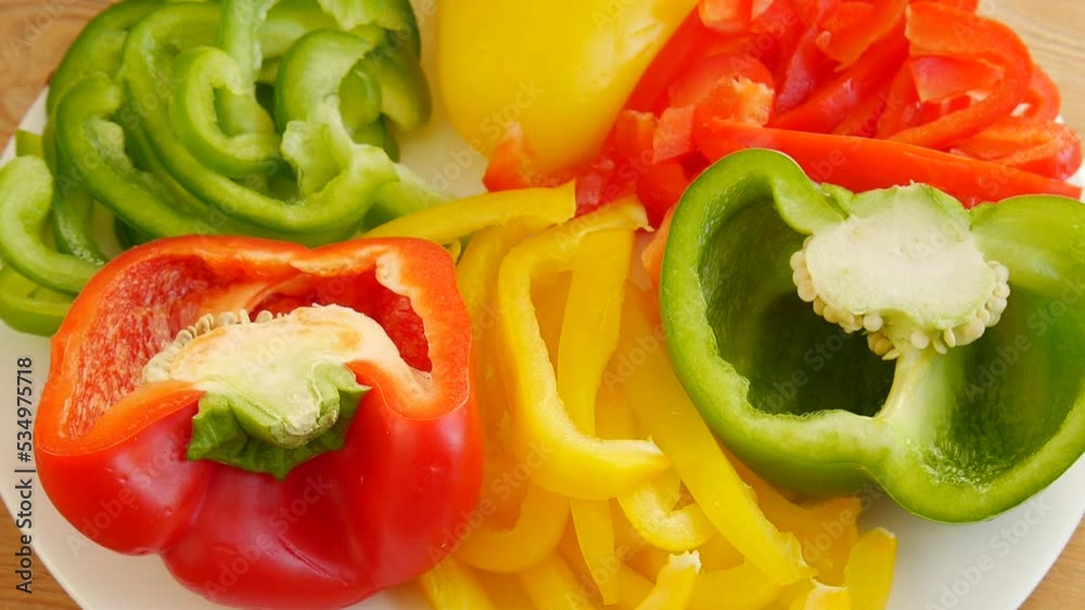 Sliced multi-colored peppers on a plate. Sliced multi-colored peppers on a plate.