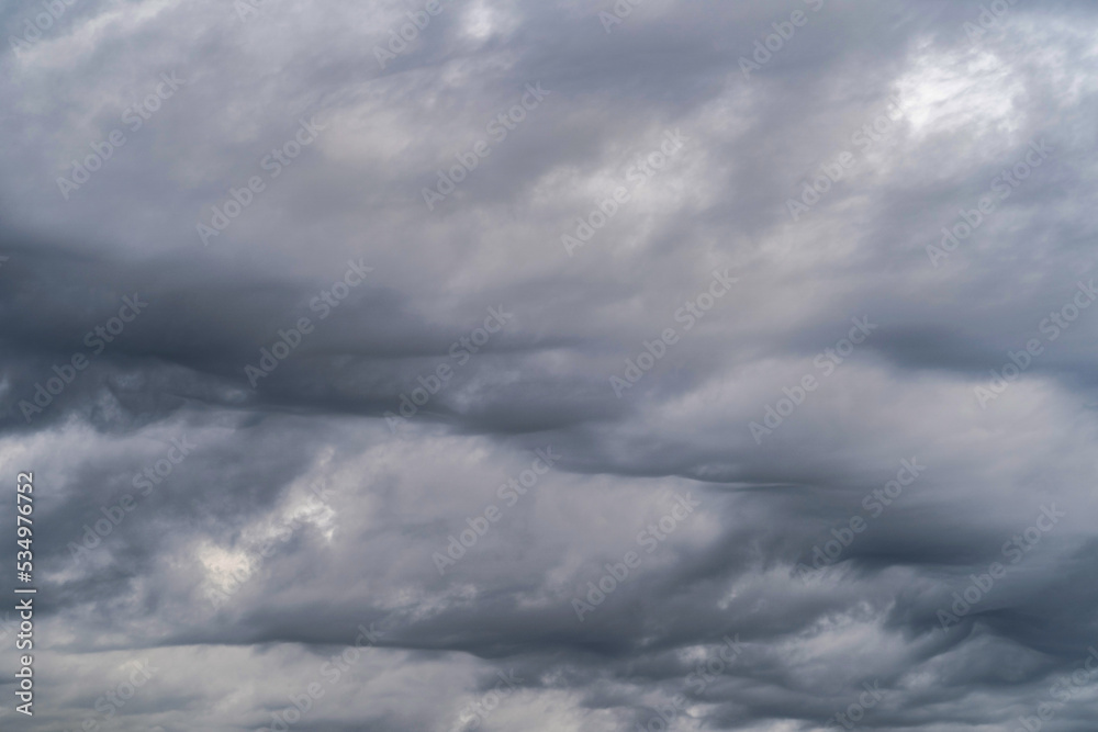 Gloomy sky with gray cumulus rain clouds during the day in the middle latitudes.