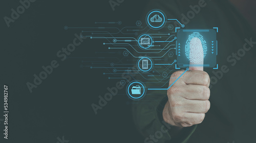 cyber security concept, man's hand scanning finger to go online to access information both accessing the system document storage Banking including online shopping This method is highly secure.