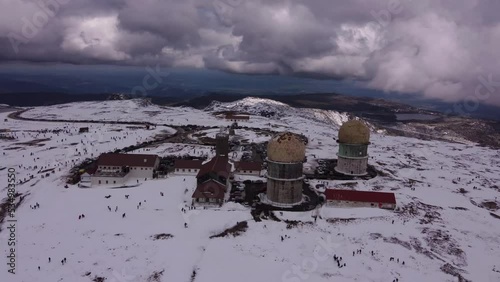 Aerial view of the Serra da Estrela Tower in Portugal with snow. It is the highest point in mainland Portugal. Shot by Drone