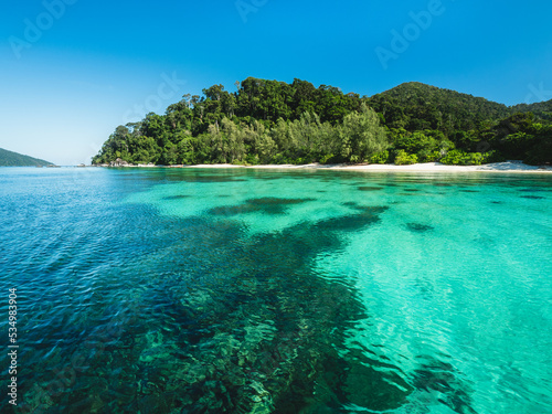 Scenic view of Koh Adang Island crystal clear turquoise sea with coral reef transparent water and summer blue sky. Near Koh Lipe Island, Tarutao National Marine Park, Satun, Thailand. Snorkeling Spot.