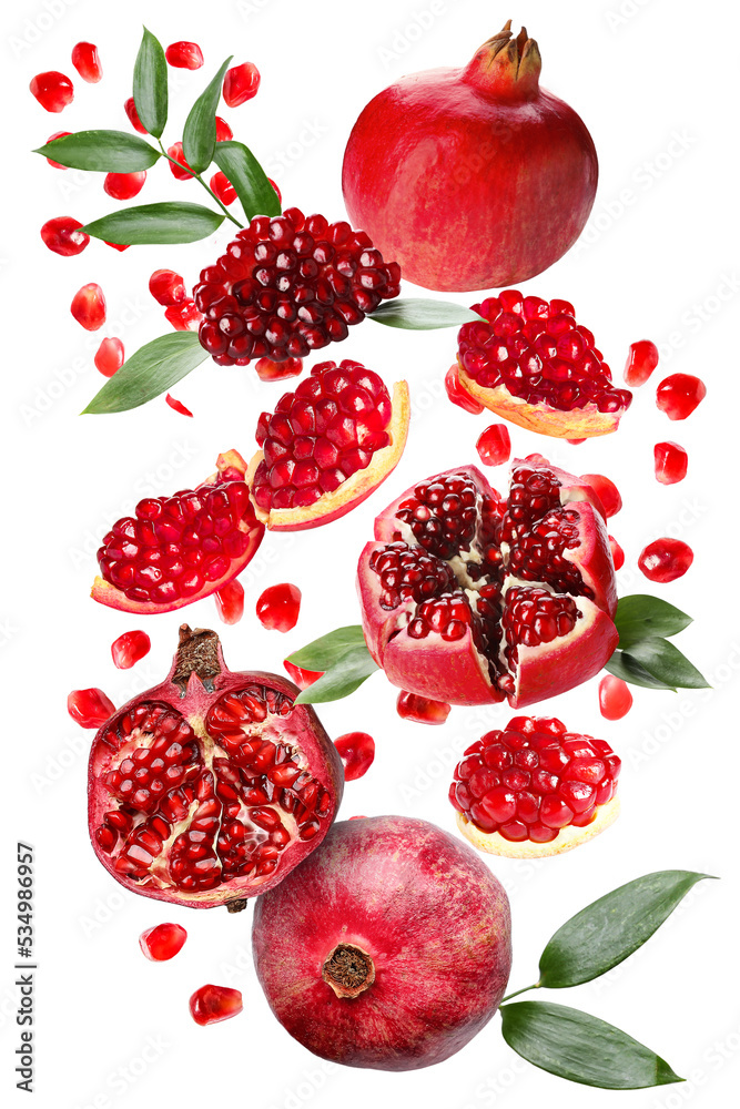 Many flying pomegranates isolated on white Many flying pomegranates isolated on white