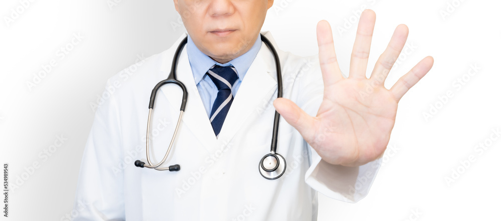 手で制止する男性医師 手で制止する男性医師