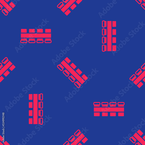 Red Hunting cartridge belt with cartridges icon isolated seamless pattern on blue background. Bandolier sign. Hunter equipment, armament. Vector