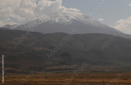 View of Mount Ararat (Agri) with snow-capped peak in light haze near the city of Dogubayazit, in Eastern Anatolia region, Turkey
