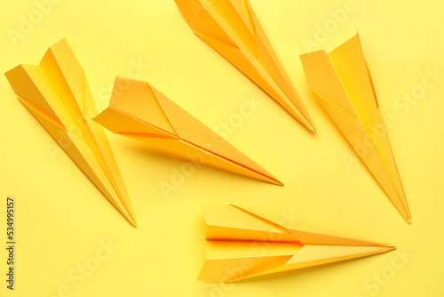 Multiple yellow paper airpl...