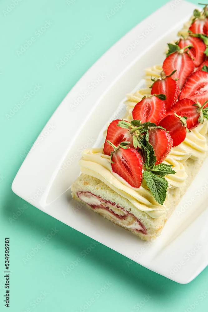 Plate with delicious strawberry roll cake on color background, closeup