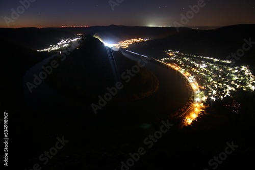 Fototapeta Naklejka Na Ścianę i Meble -  The Moselle loop in the night before sunrise, beautiful landscape shot from a vantage point. Backlight, lighting, cliff. Nice cold winter morning